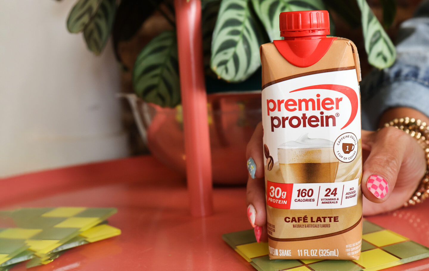 A tetra bottle of Premier Protein Caffe Latte Protein Shake.