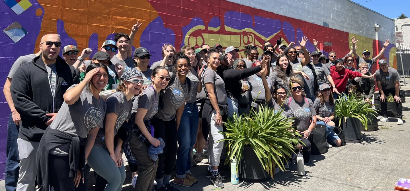 A large group of Premier Nutrition employees during a company-wide giving back day.